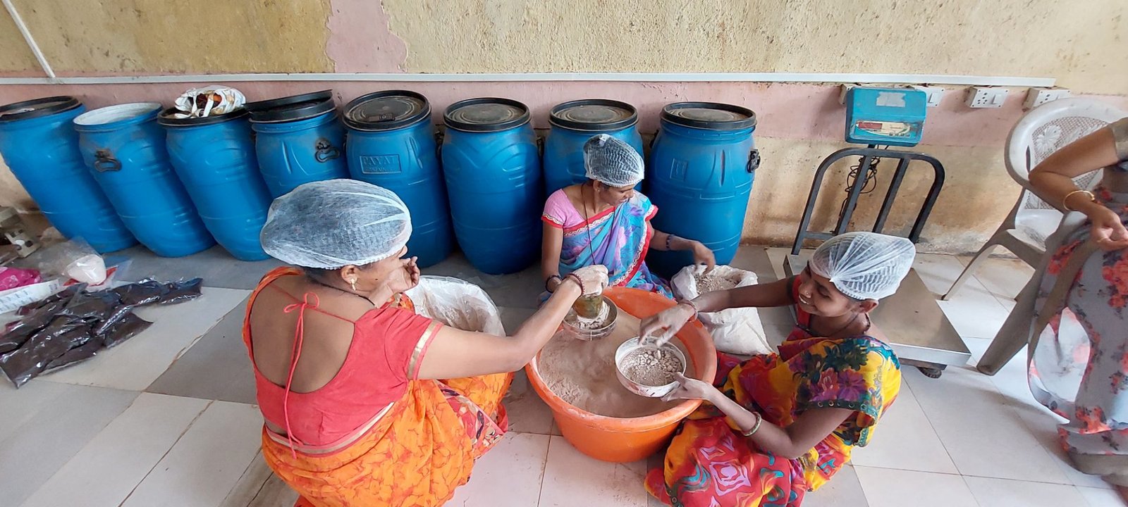 Women sifting turmeric powder